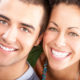 Happy smiling couple. Teeth whitening safety tips in Anchorage
